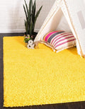 Unique Loom Solid Shag Collection Area Rug (7' 1" x 10' Rectangle, Tuscan Sun Yellow)